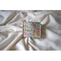 Yellow and green quilted coin pouch