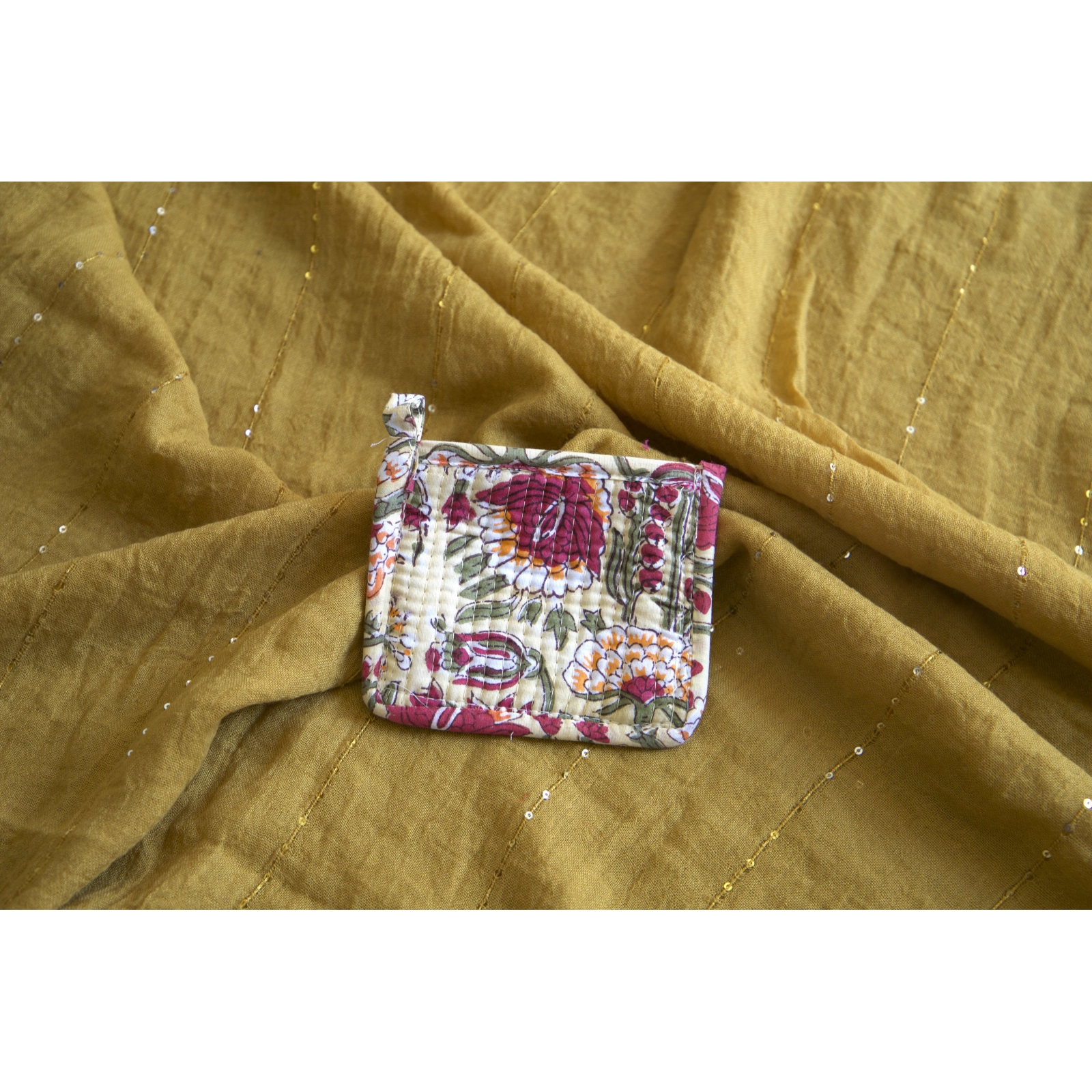 Beige quilted coin pouch